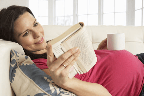 pregnant lady reading a book 