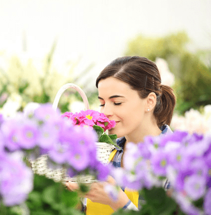 woman smelling spring flowers