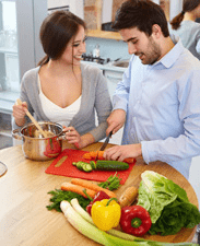 couple cutting vegetables 