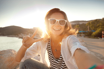 girl wearing sunglasses, peace sign